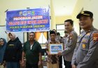 Peduli Warga Bantaran Sungai, Polres Kuansing Gelar Pelayanan Kesehatan dan Bansos di Cerenti